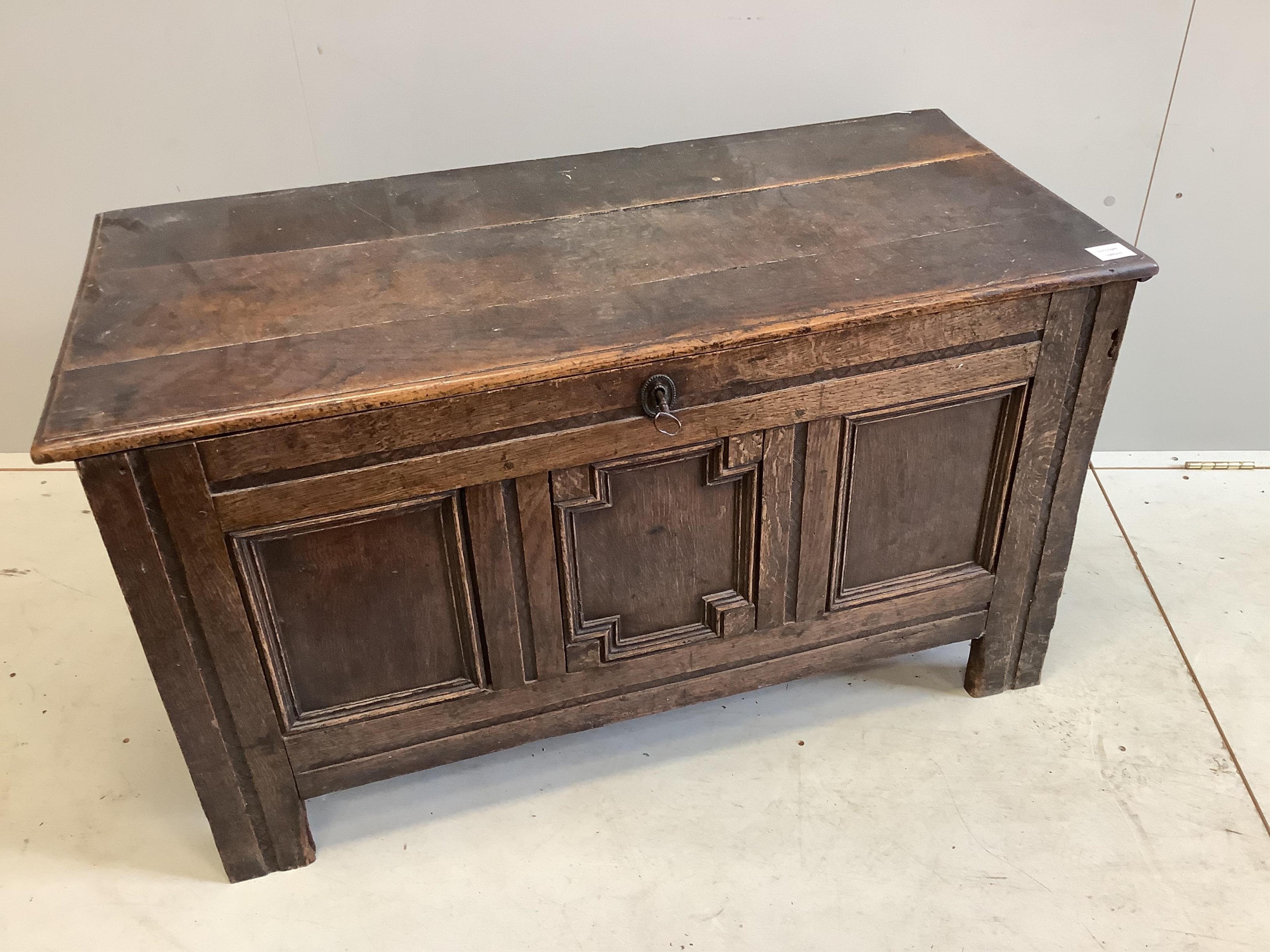 An early 18th century panelled oak coffer, width 108cm, depth 50cm, height 61cm. Condition - poor to fair